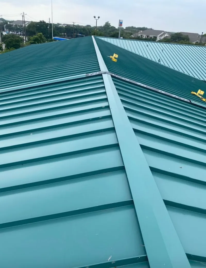 Green commercial metal roof ridge and valley for Metal Roof Repair in Cheltenham